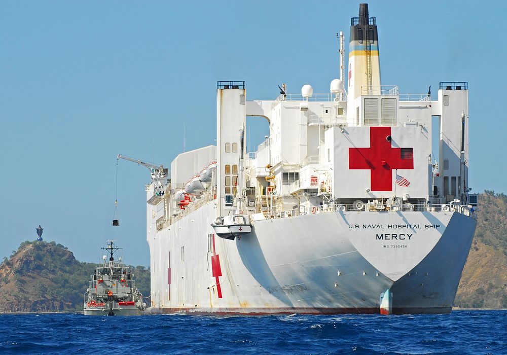 The Military Sealift Command Hospital Ship USNS Mercy (T-AH 19) Transfers Cargo Aboard the Royal Australian Navy Heavy…