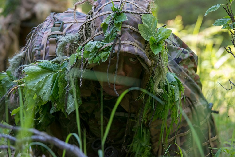 Arctic Aurora 2019A sniper from the 1st Airborne Brigade Japanese Ground Self-Defense Force avoids detection while leaving…