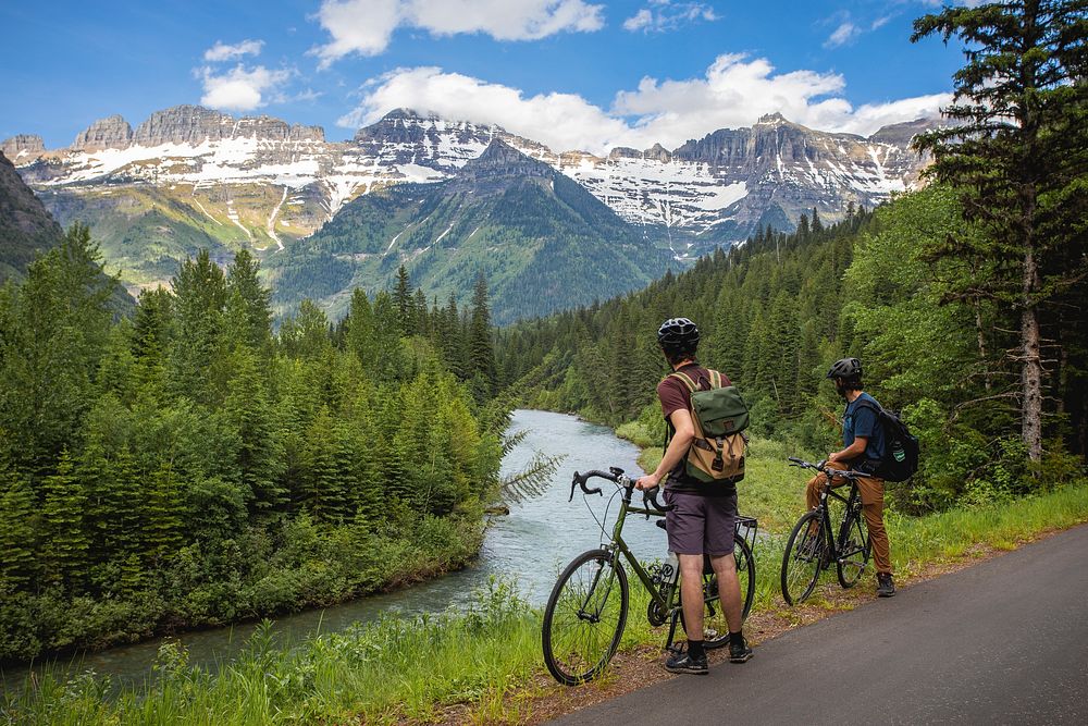 Cyclists in Glacier National Park. A quick break along the Going-to-the-Sun Road. Original public domain image from Flickr