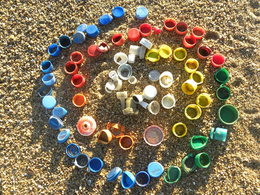 Colorful caps on sand. Original public domain image from Flickr