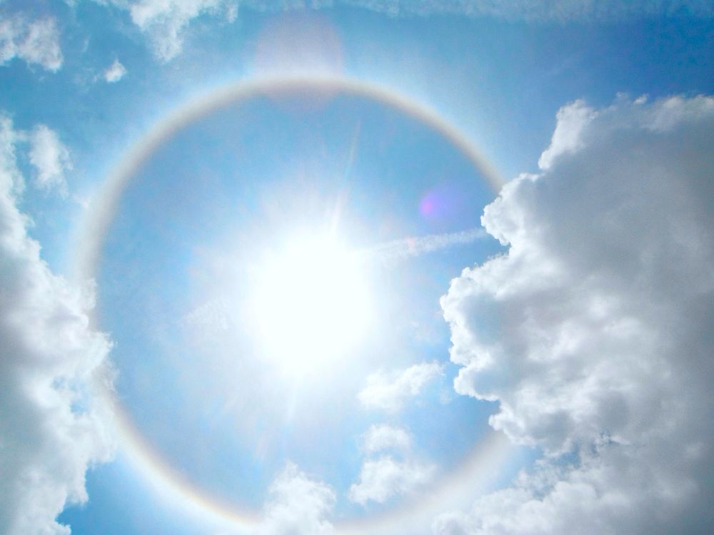 Rainbow ring around sun. Free public domain CC0 photo.