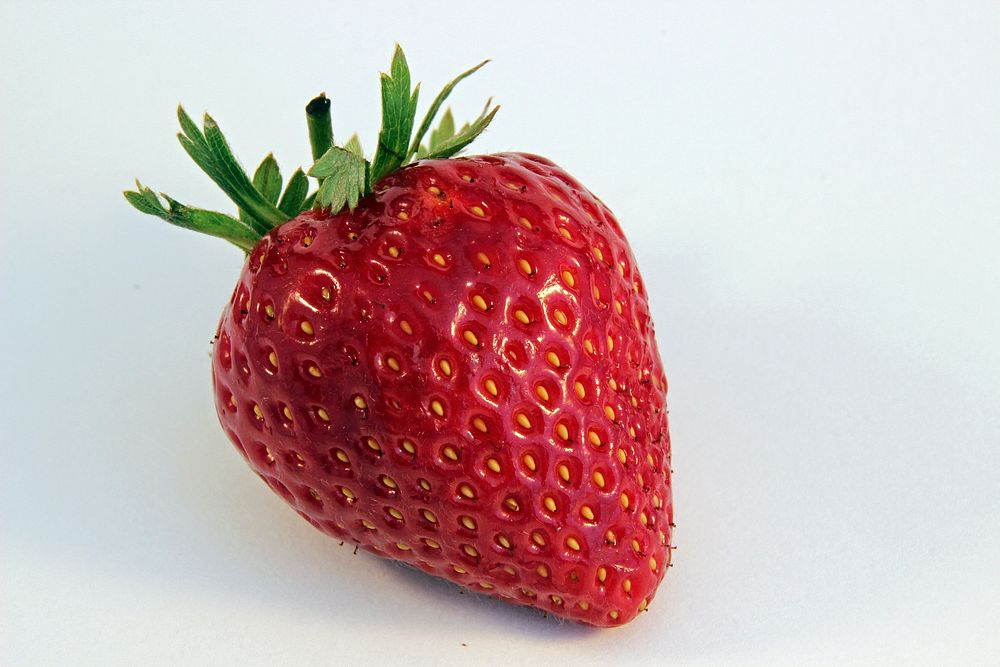 Fresh strawberry on white background. Free public domain CC0 image.