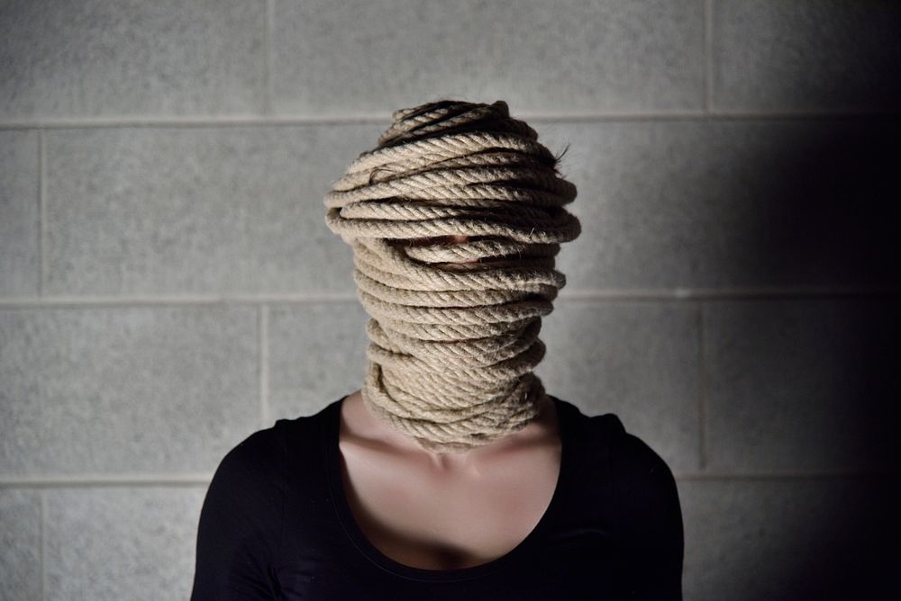 Woman wrapped in rope. Free public domain CC0 photo.
