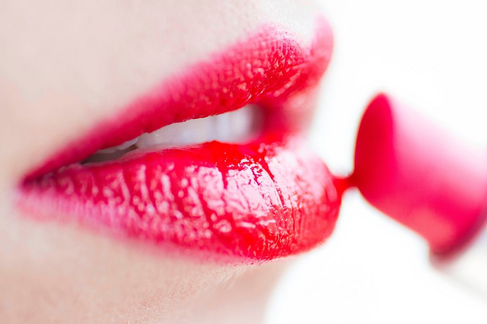 Woman wearing red lipstick close up view, free public domain CC0 photo.