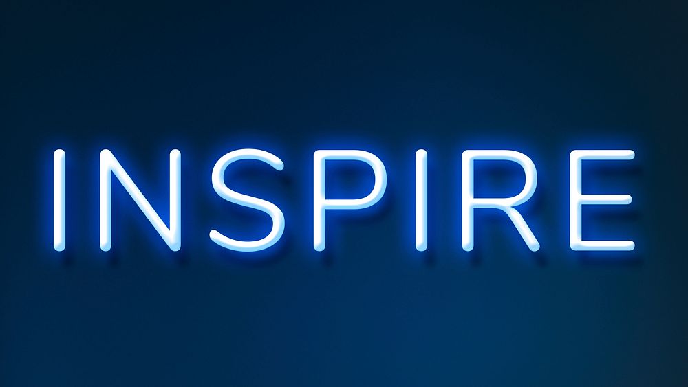 INSPIRE neon word typography on a blue background