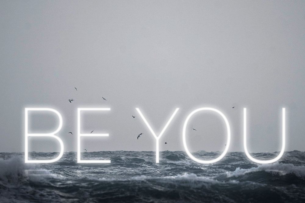 White neon text BE YOU typography