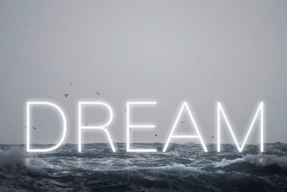 White neon text DREAM typography