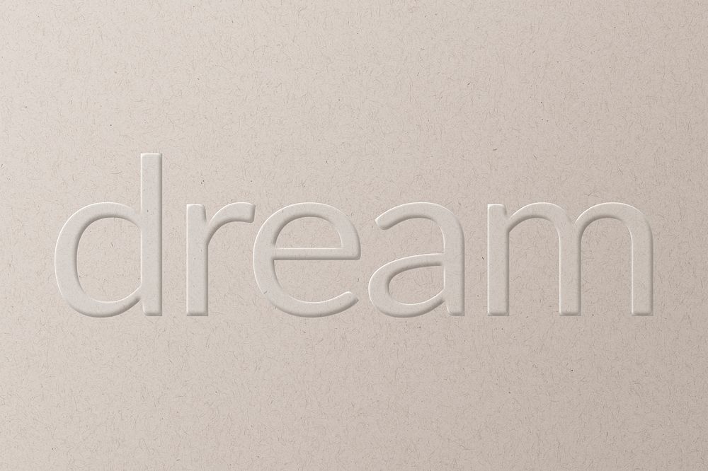 Dream embossed text white paper background