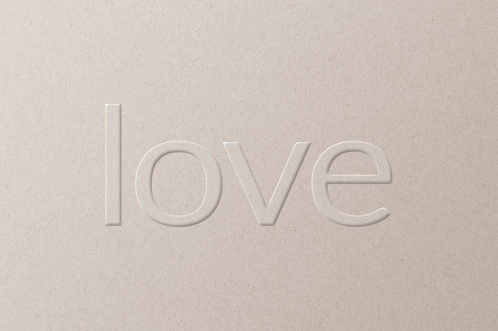 Love embossed text white paper background