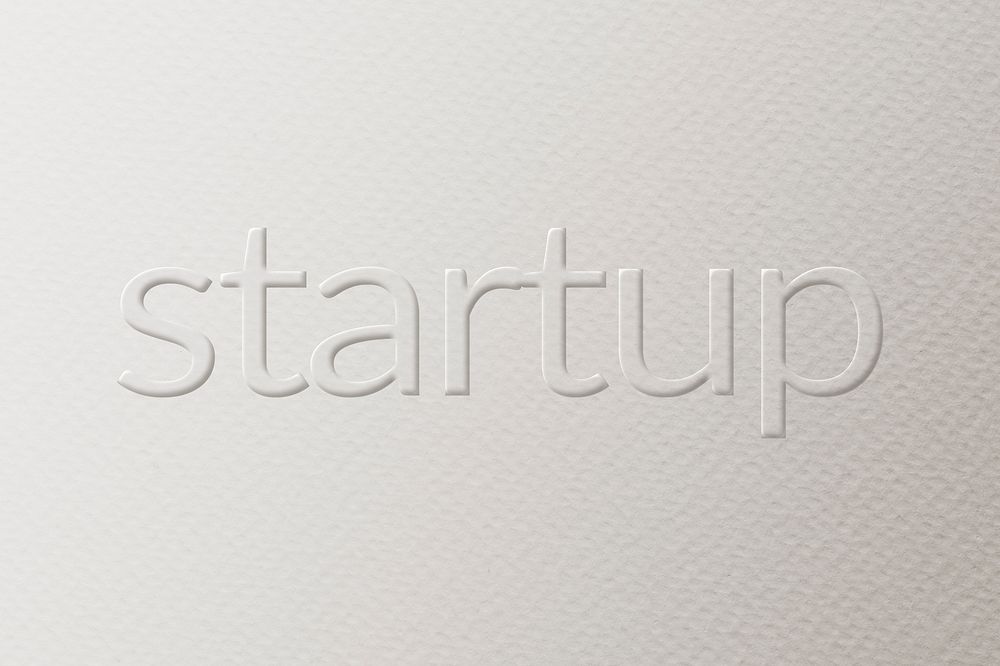 Startup embossed typography white paper background