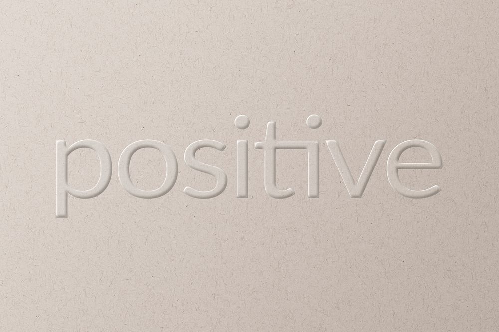 Positive embossed typography white paper background