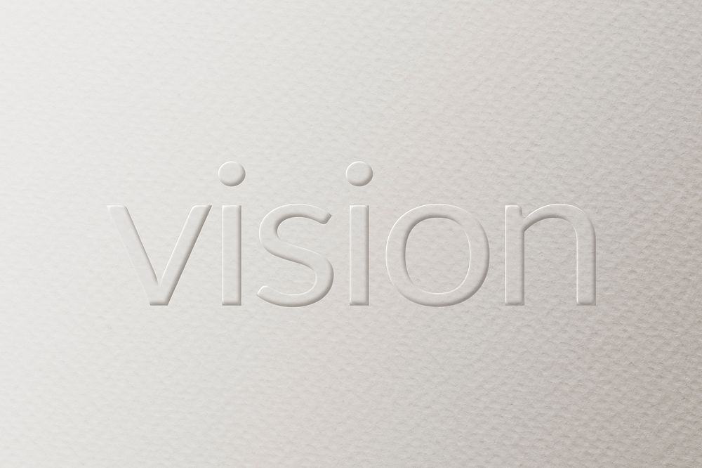 Vision embossed text white paper background
