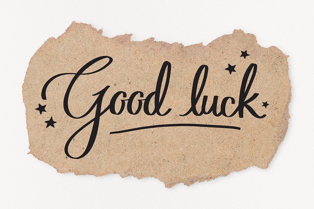 Good luck word, black calligraphy on ripped kraft paper