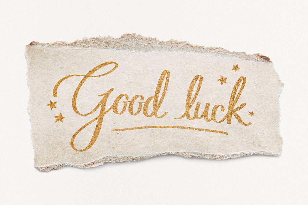 Good luck word, gold glittery calligraphy on ripped paper