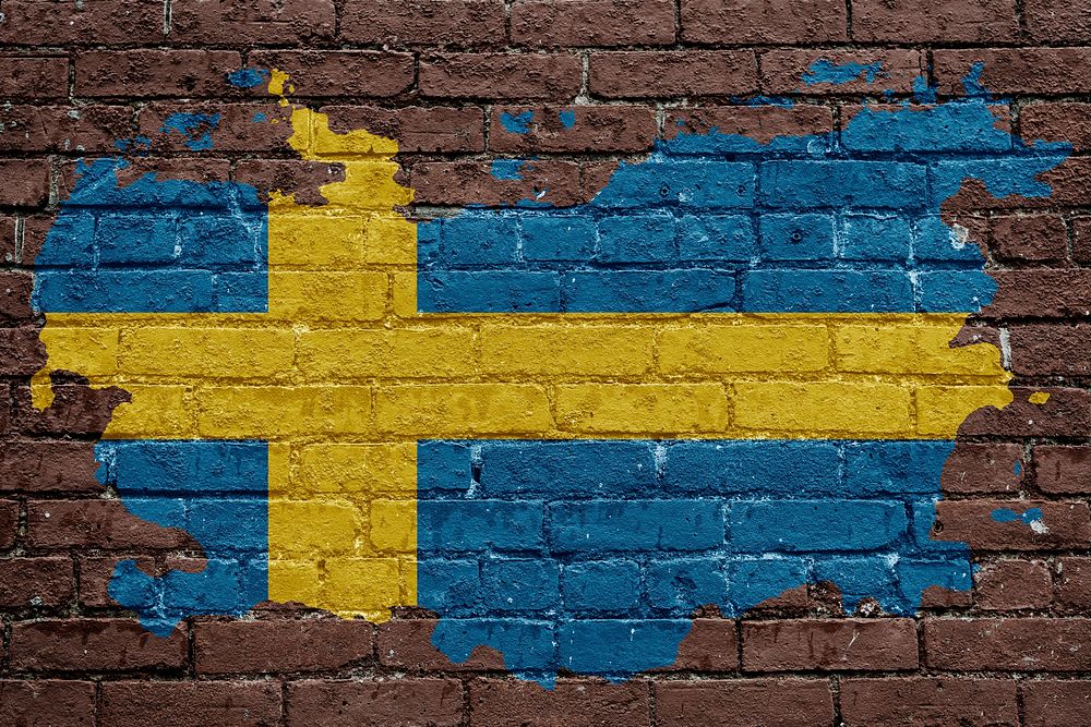 Sweden's flag, brown brick wall texture design