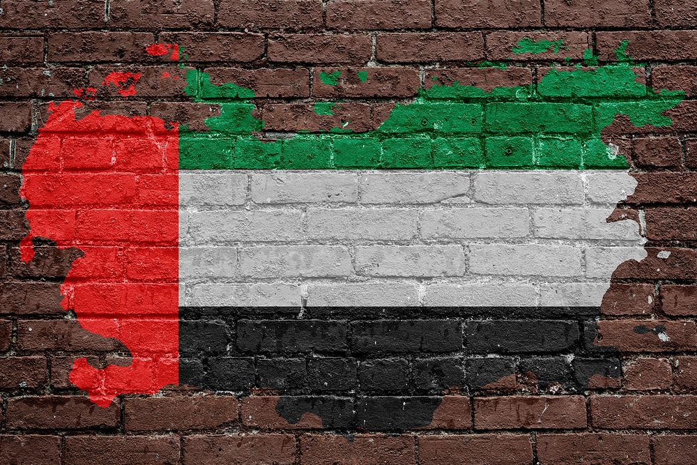 UAE flag, brown brick wall texture design