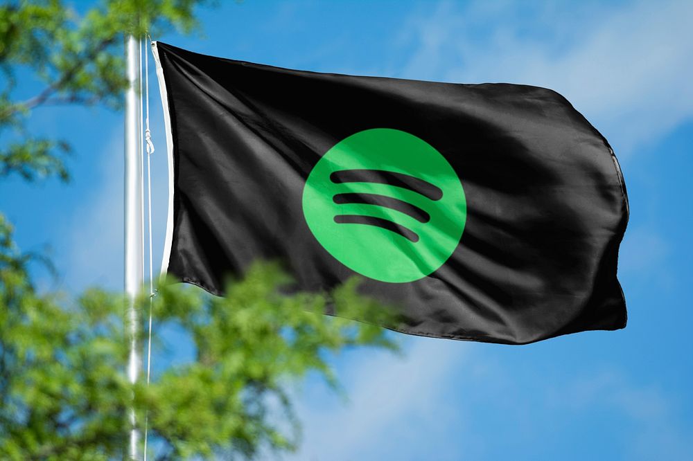 Spotify icon for social media on flag. 26 MAY 2022 - BANGKOK, THAILAND