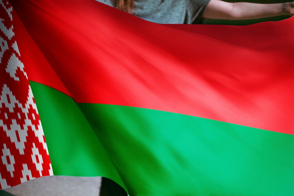 Person holding Belarus flag background, national symbol