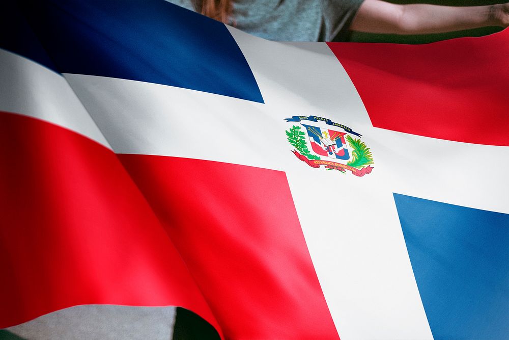 Person holding Dominican Republic flag background, national symbol