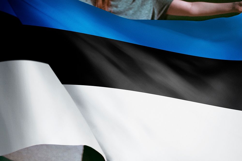 Person holding Estonia flag background, national symbol