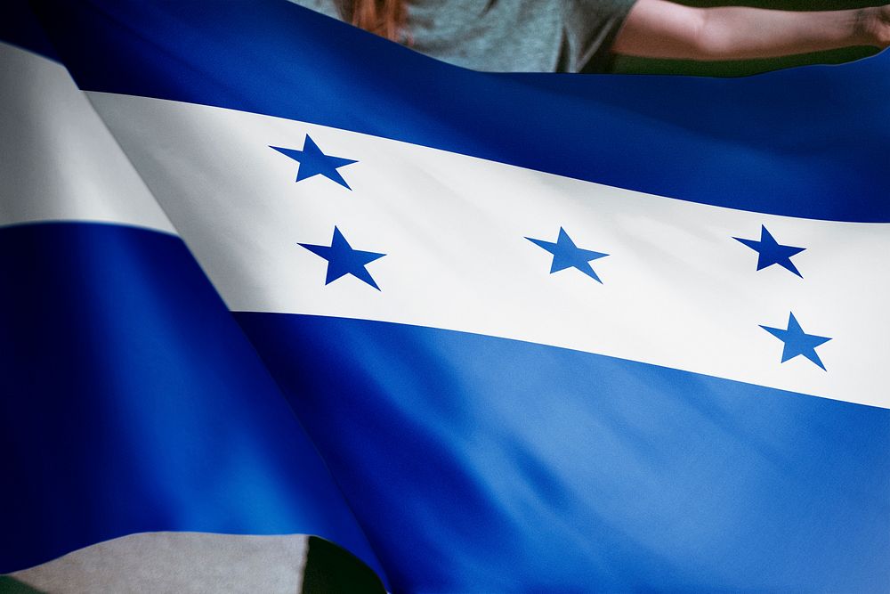 Person holding Honduras flag background, national symbol