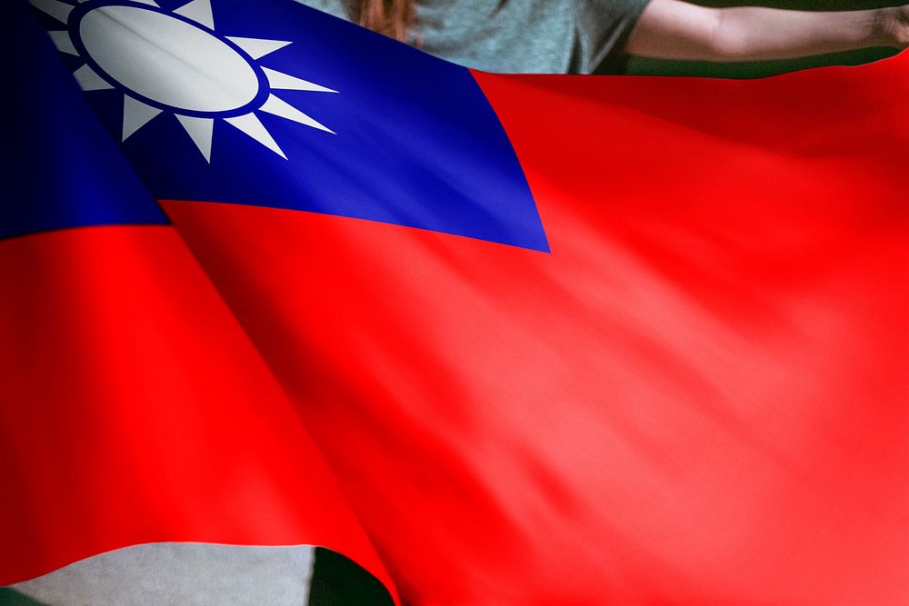 Person holding Taiwanese flag background, national symbol