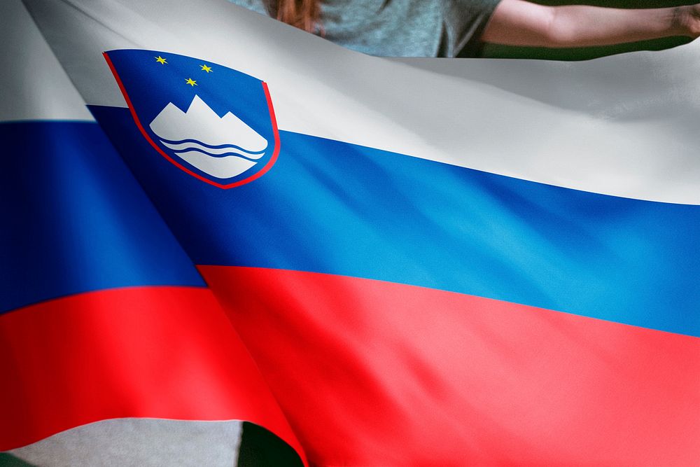 Person holding Slovenia flag background, national symbol