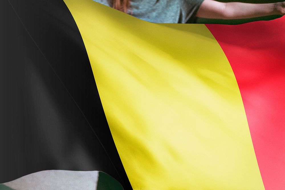 Person holding Belgium flag background, national symbol