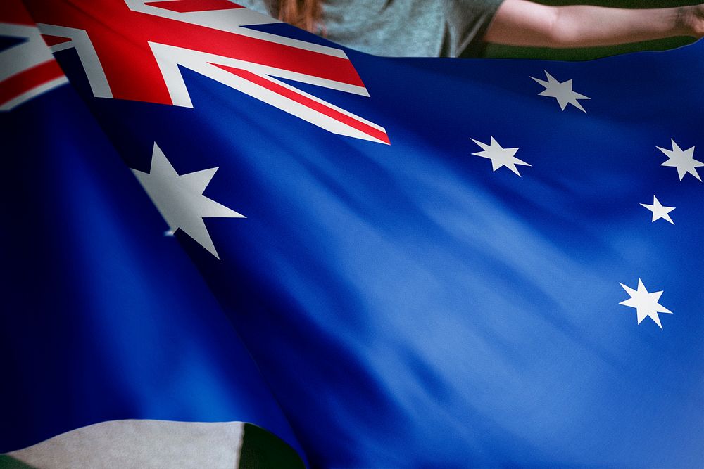 Person holding Australia flag background, national symbol