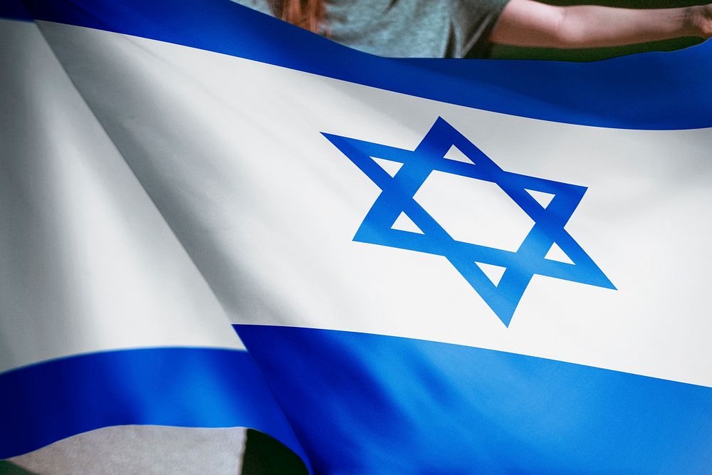 Person holding Israel flag background, national symbol