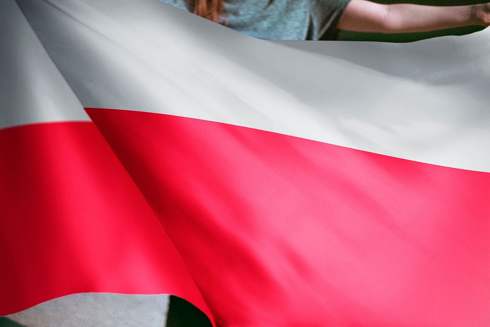 Person holding Poland flag background, national symbol