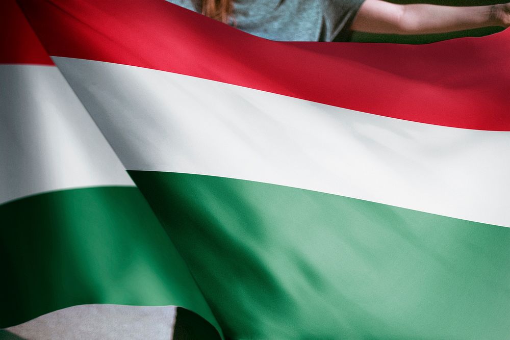 Person holding Hungarian flag background, national symbol