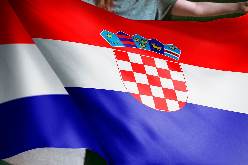 Person holding Croatia flag background, national symbol