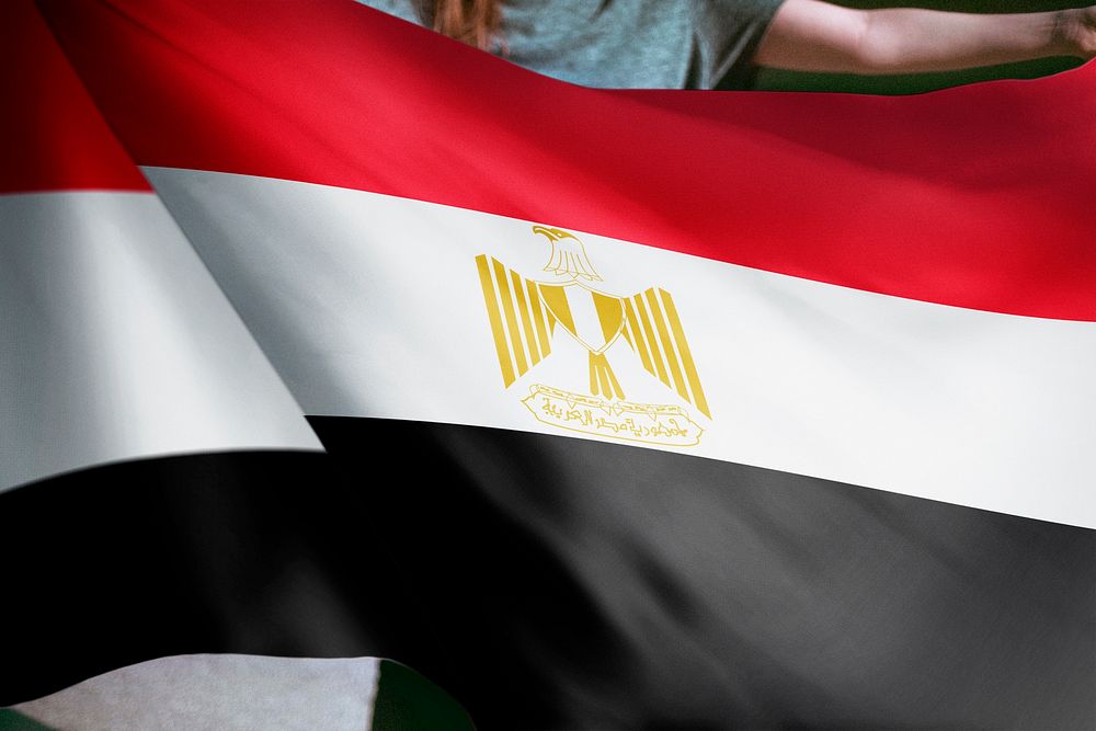 Person holding Egyptian flag background, national symbol