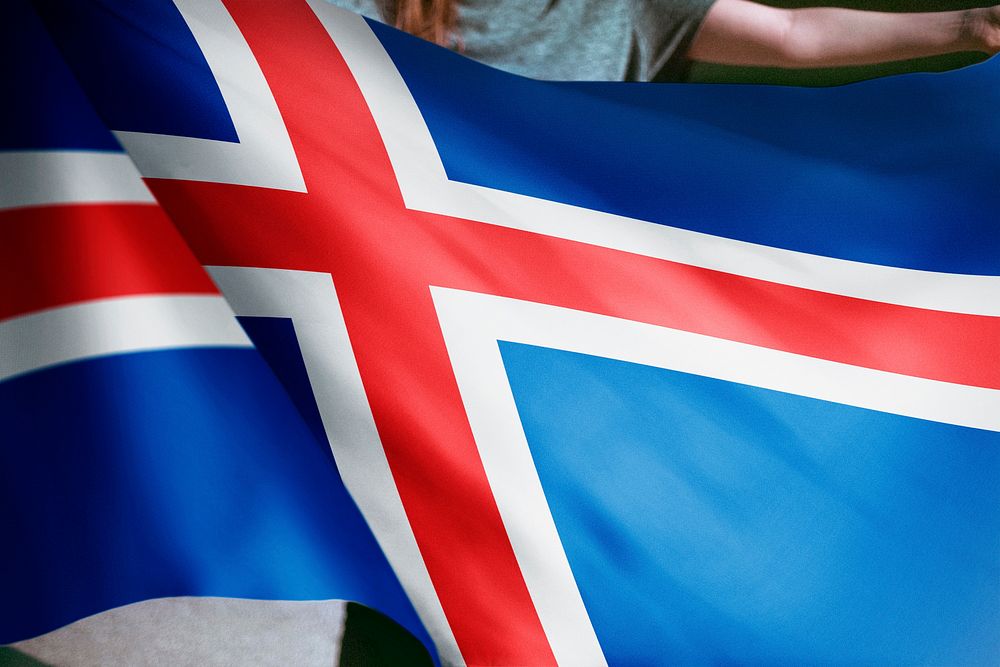 Person holding Iceland flag background, national symbol