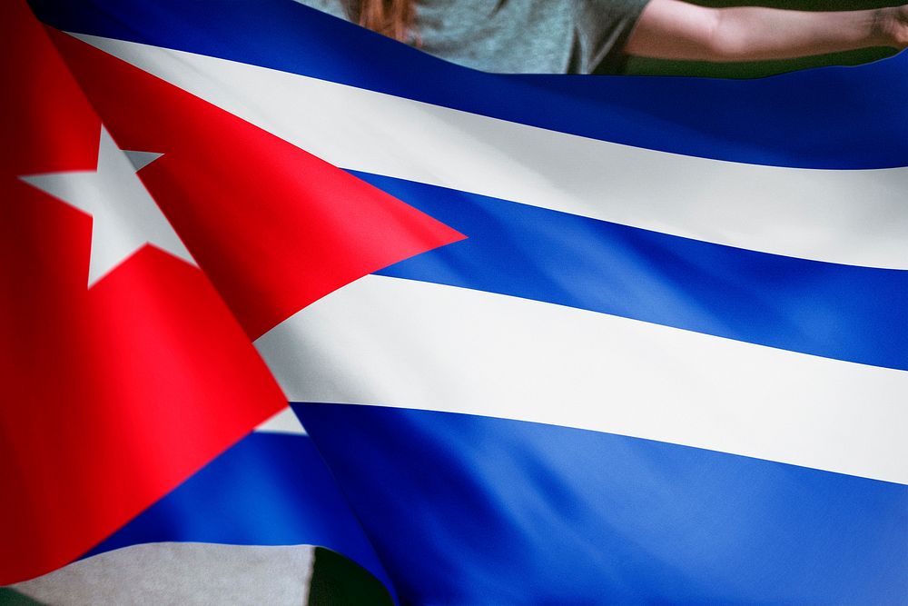 Person holding Cuban flag background, national symbol