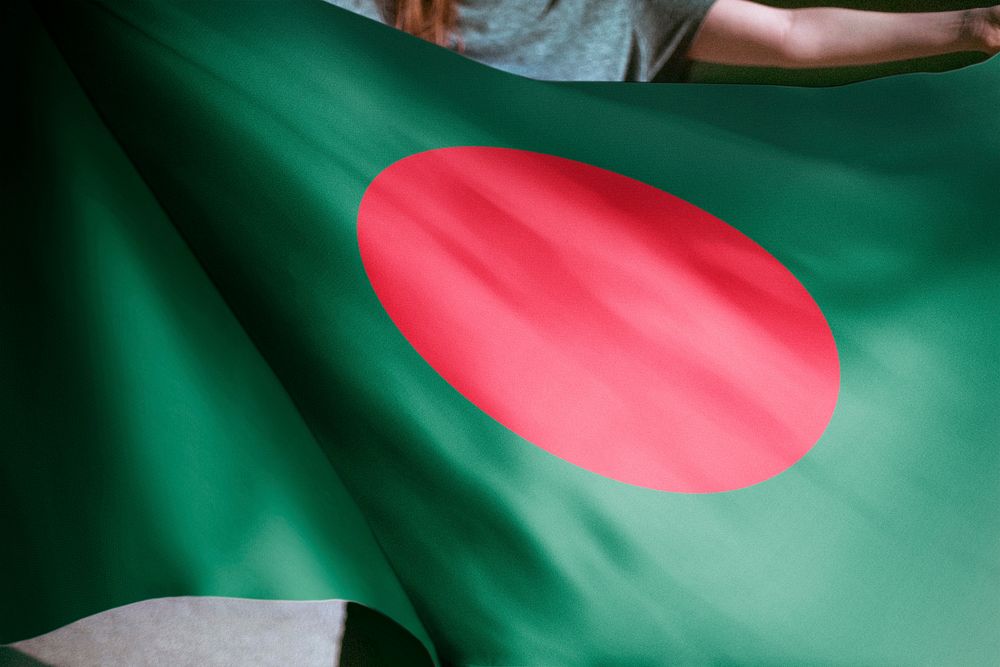 Person holding Bangladeshi flag background, national symbol