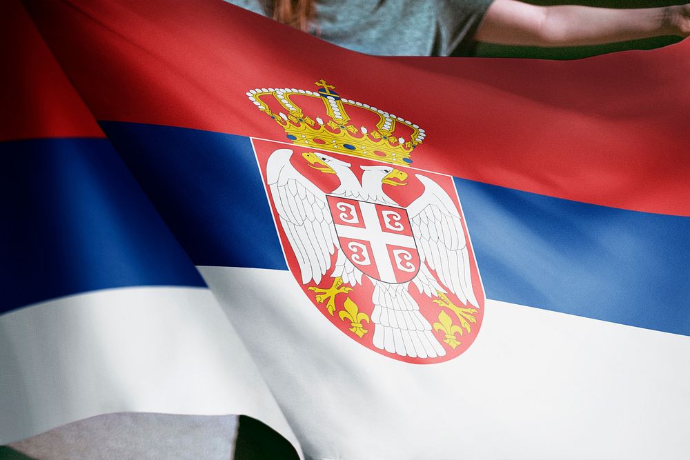 Person holding Serbia flag background, national symbol
