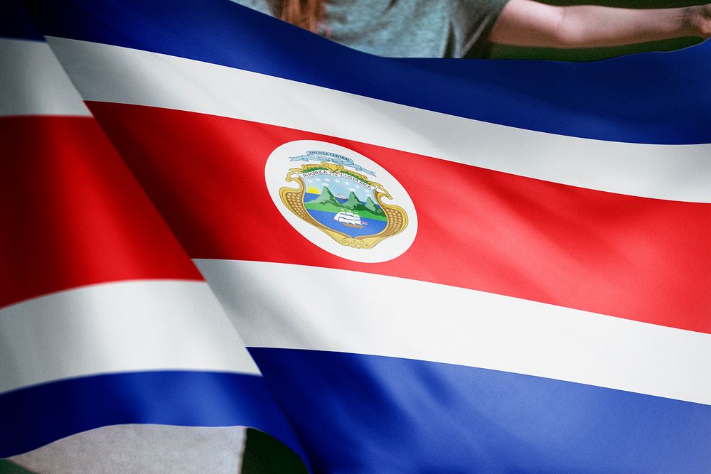 Person holding Costa Rica flag background, national symbol