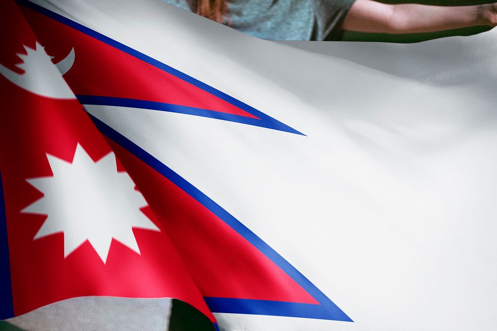 Person holding Nepalese flag background, national symbol
