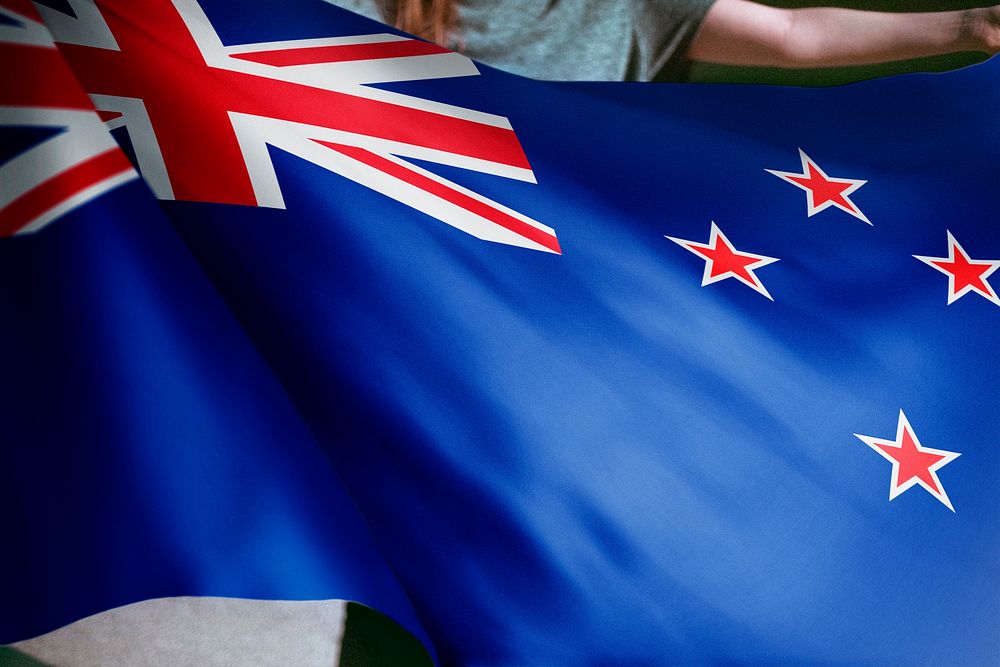 Person holding New Zealand flag background, national symbol