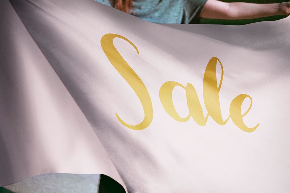 Person holding pink sale flag background