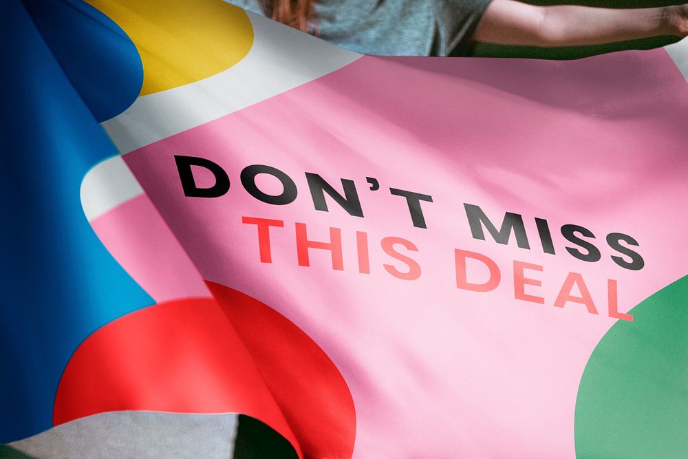 Person holding Don't miss this deal flag background