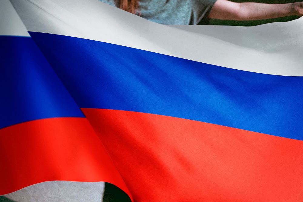 Person holding Russian flag background, national symbol