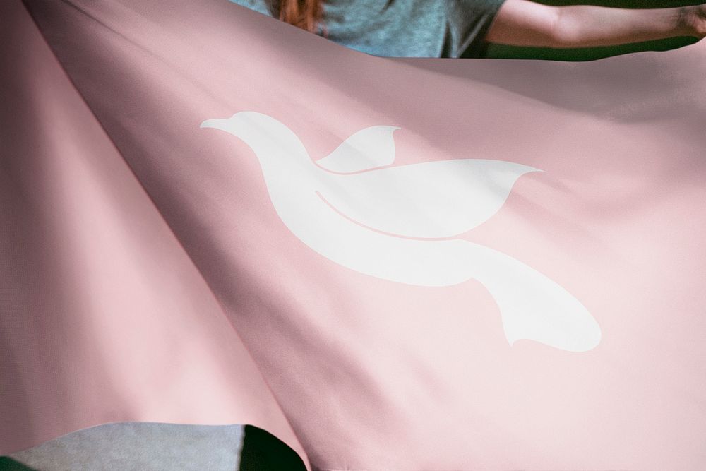 Person holding pink dove flag background