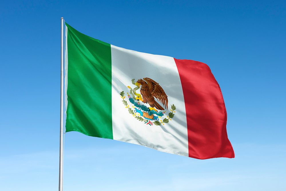 Waving Mexico flag, national symbol, blue sky