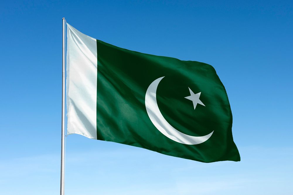 Waving Pakistan flag, national symbol, blue sky