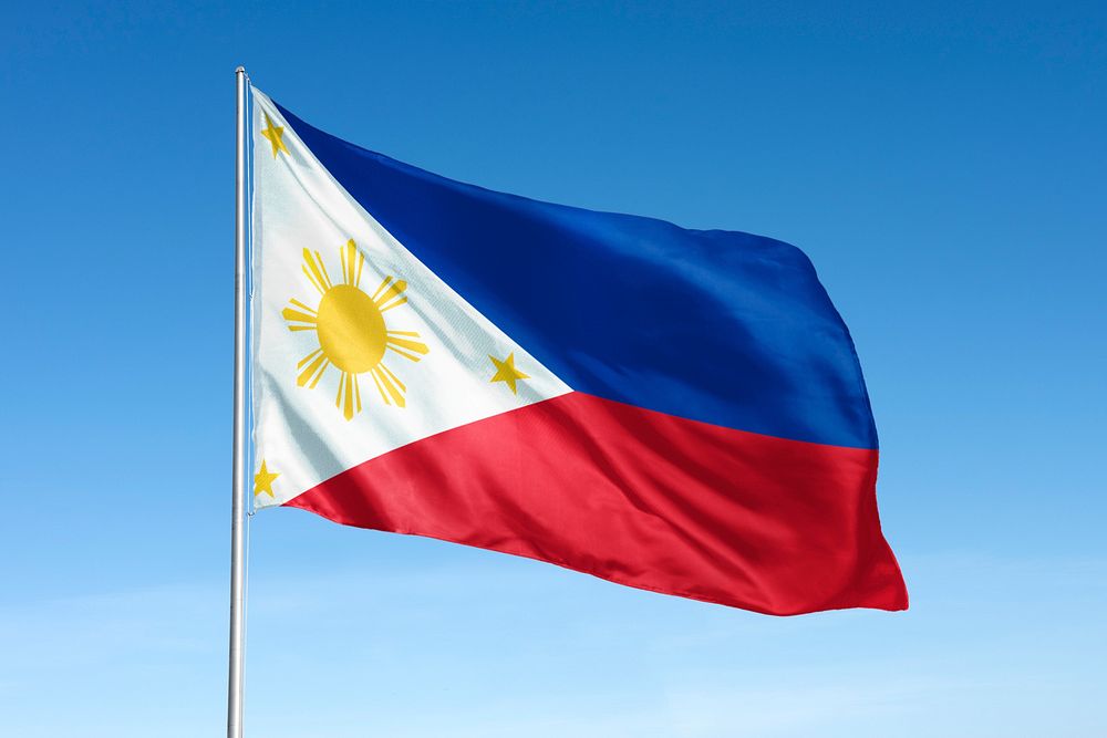 Waving Philippines flag, national symbol, blue sky