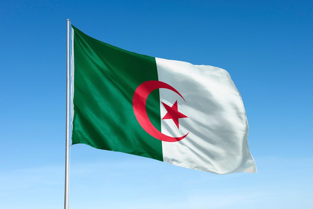 Waving Algeria flag, national symbol, blue sky