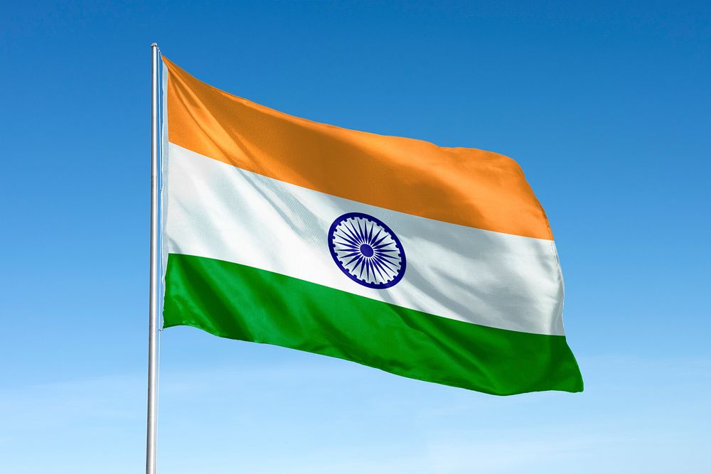 Waving India flag, national symbol, blue sky